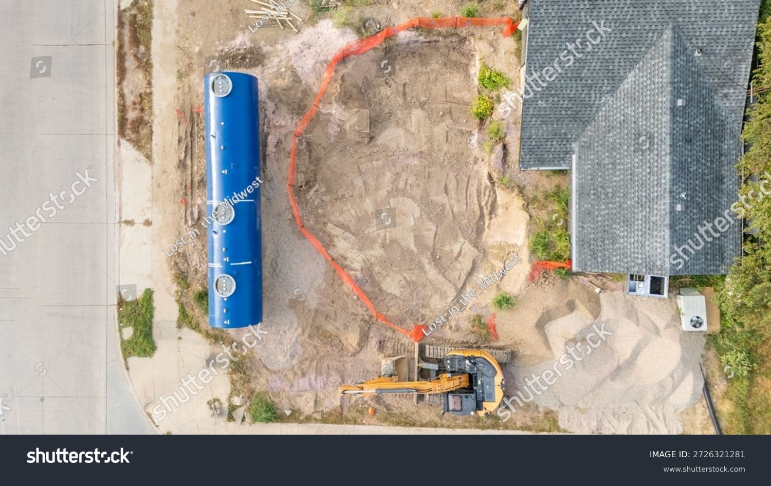 stock-photo-aerial-view-of-a-construction-site-installing-a-new-underground-storage-tank-at-a-gas-station-2726321281
